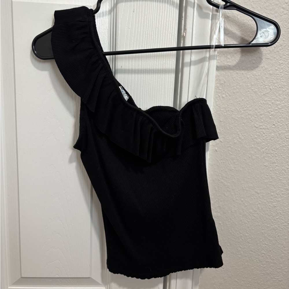 one-shoulder black top with ruffle detail